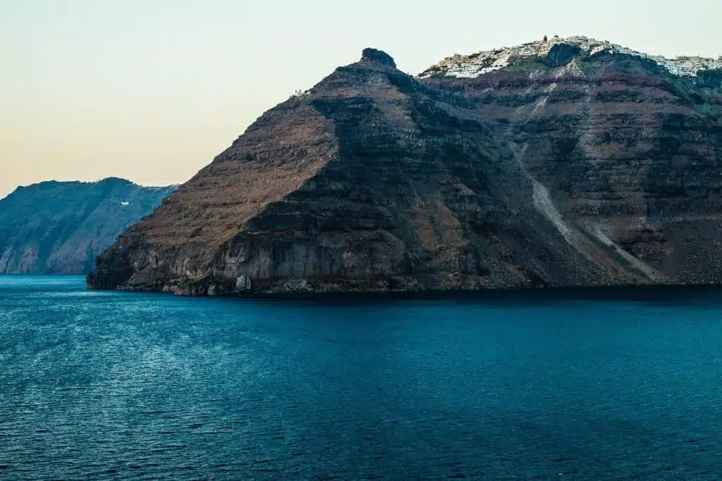 Cliff Diving In Santorini On A Mediterranean Adventure Holiday